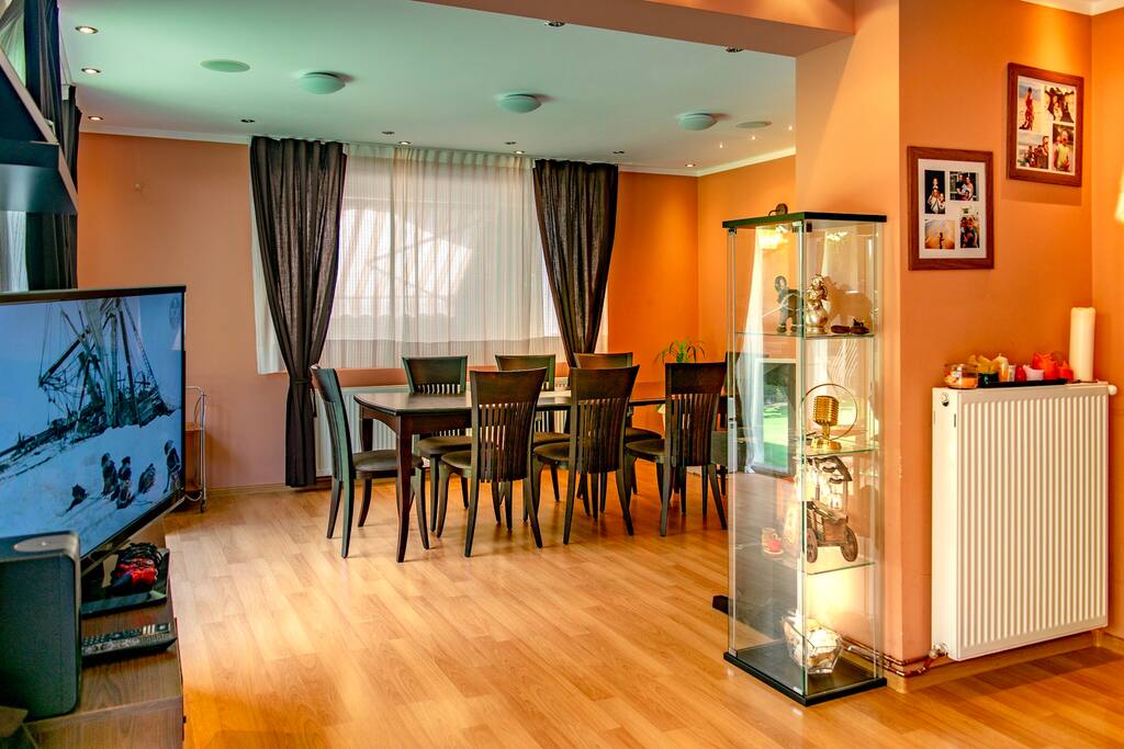 Part of the living room with the dining table for 8 people!