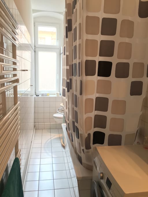 bathroom with bath tub and toilet
