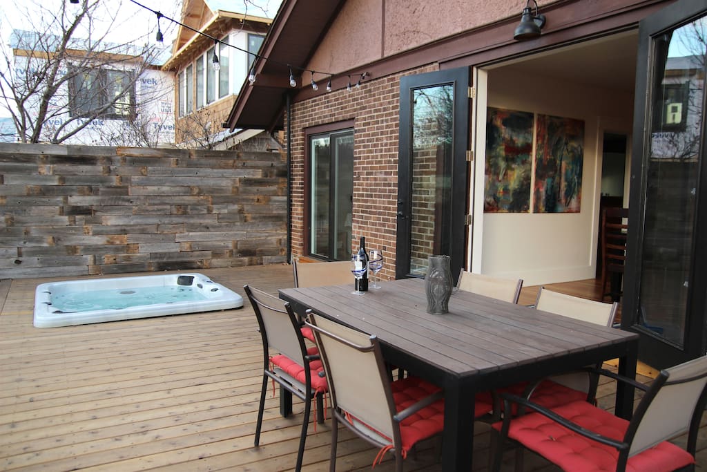 Beautiful indoor-outdoor backyard space with brand new deck and built-in hot tub