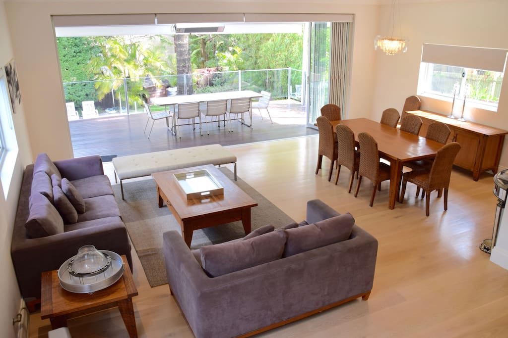 Spacious open plan living and dining area expanding to the entertainment deck.