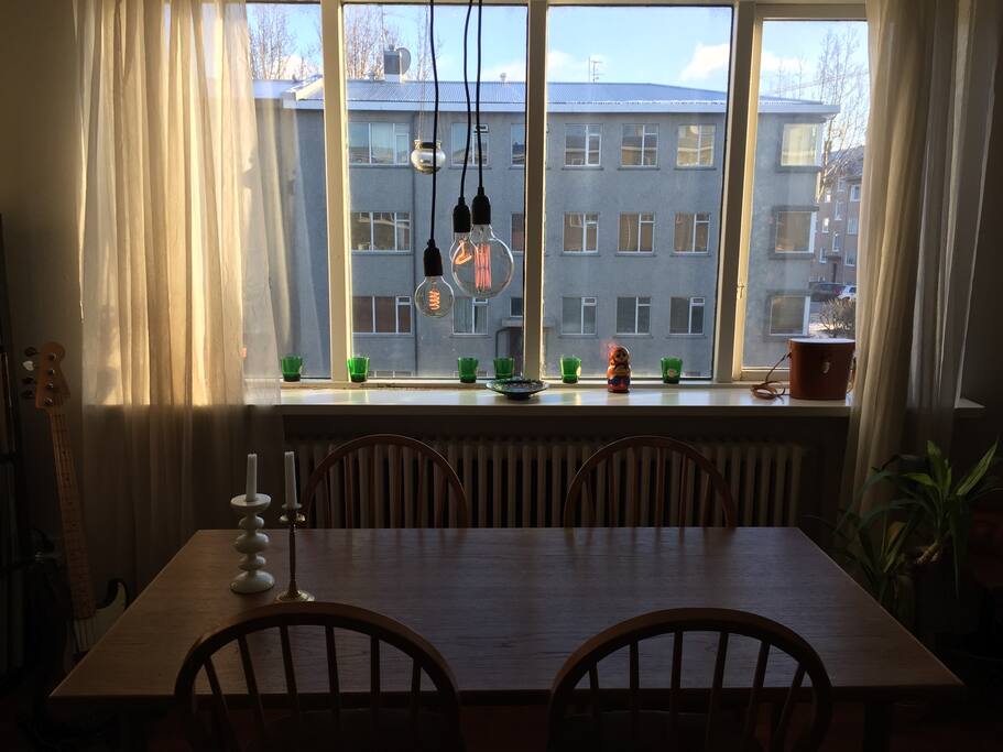 Dining table and big windows.