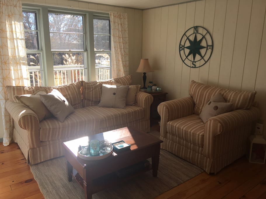 Living room features HD TV, board games, DVD and super comfy couches