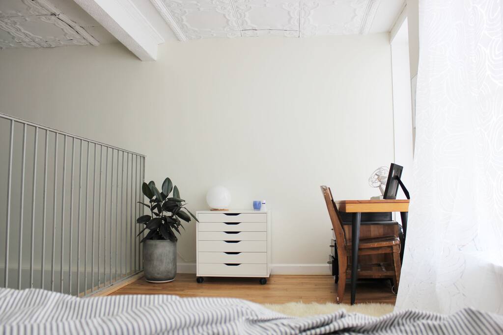 Desk and lamp in loft area.