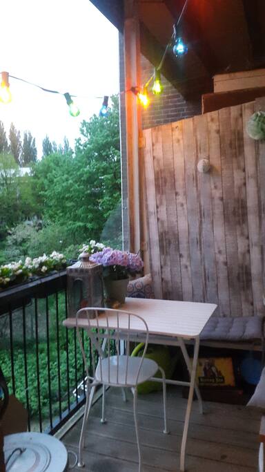 The balcony with cosy lights, sun in the morning. Nice place for breakfast when the weather allows it!