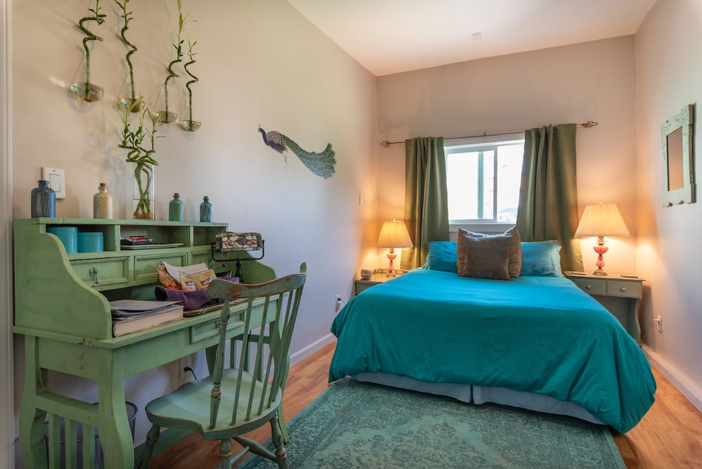 The front room bedroom with very comfortable queen sized bed awaits you for a restful sleep. In this room there is also a kitchen area, cable television, desk and full closet.