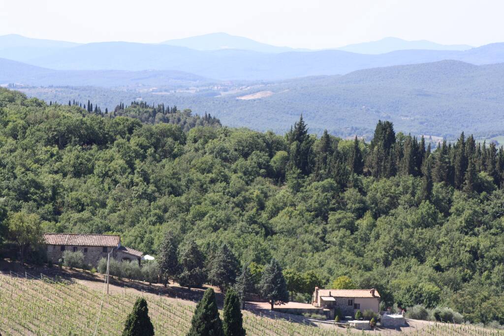 Villa and cottage with hills skyline