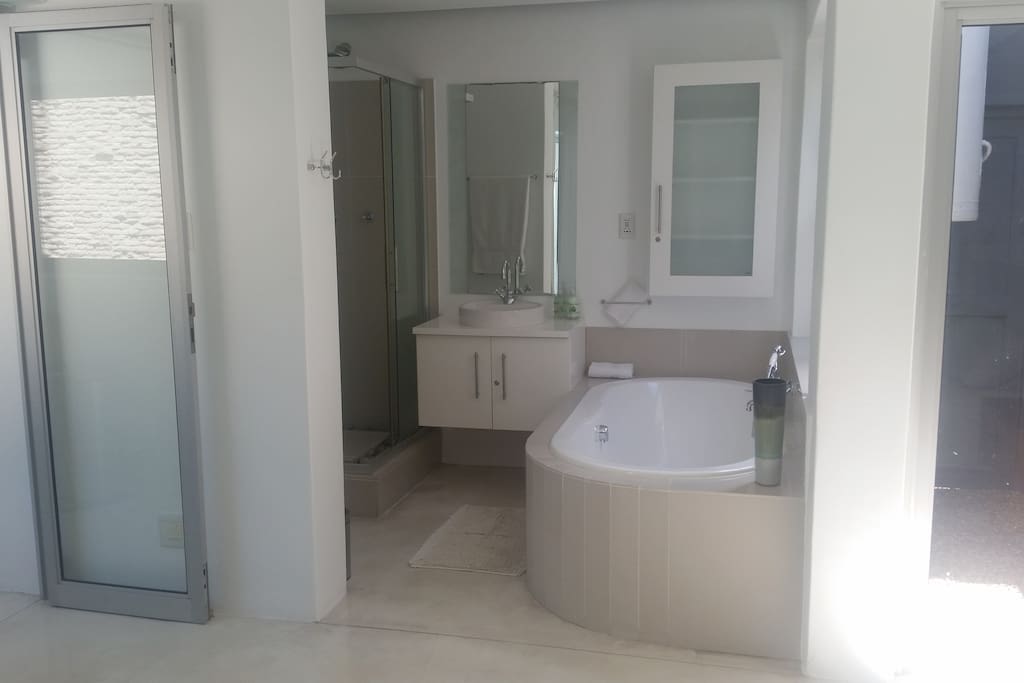 En suite bathroom with bath and separate shower