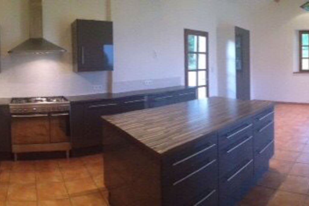 Airy kitchen diner with stunning views over terrace, and underfloor heating.