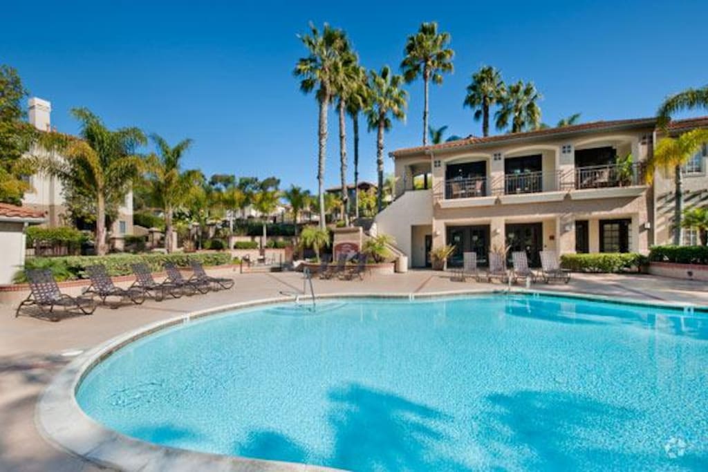 Development, Torrey Villas, has two swimming pools and a hot tub , fitness center , club house