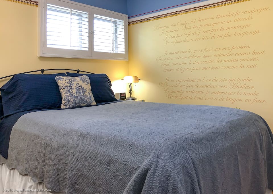 Hand-painted mural of a Victor Hugo poem in French. We’ll give you an English translation!