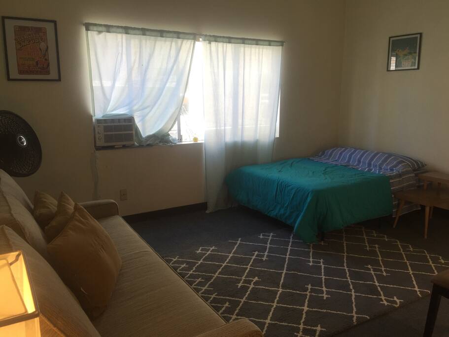 Full sized bed facing the queen hide-a-bed