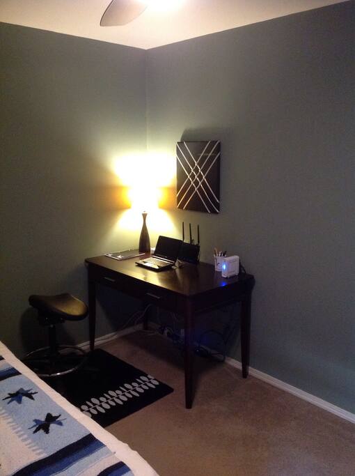 Writing desk with small computer for guest use. High-speed Internet and wireless network.