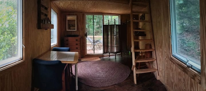 Treehouse living room - Treehouse has four large windows and a sliding glass door with screens including heating and isolating fans. Built to code and permitted, fully installed, and how power outlets.