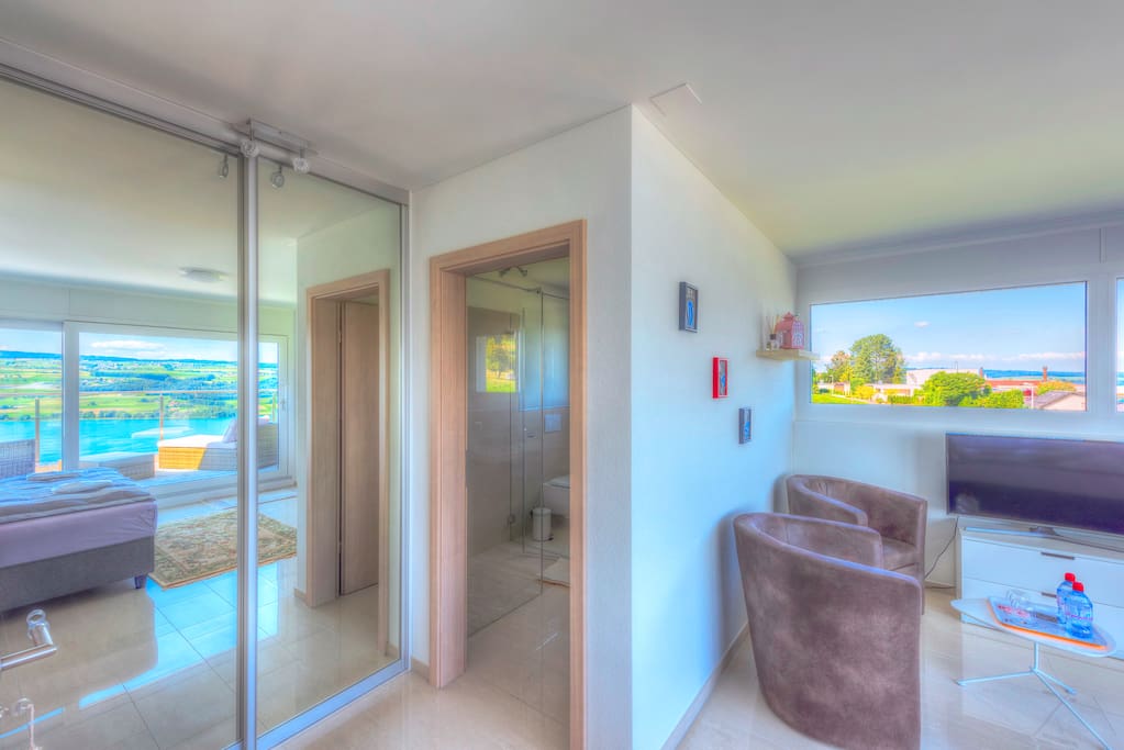 Walk-in closet behind mirror-doors; Large private bathroom