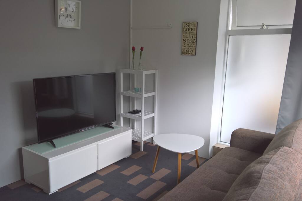 A small but lovely living room with a large TV (where you can access Netflix)