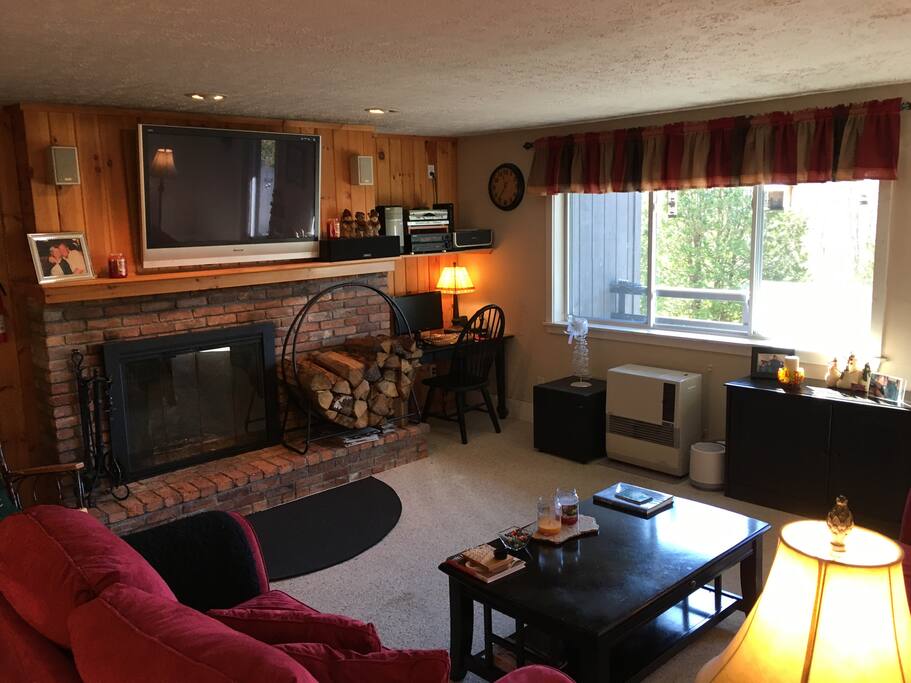 Larger living room with big screen TV, computer work station, and WiFi.