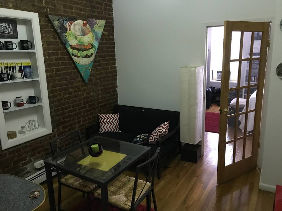 Cozy living room with dining table and sofa bed