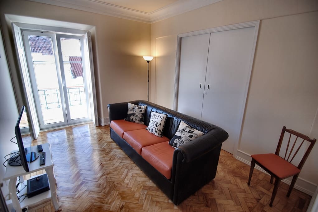 Living room with balcony and cable TV
