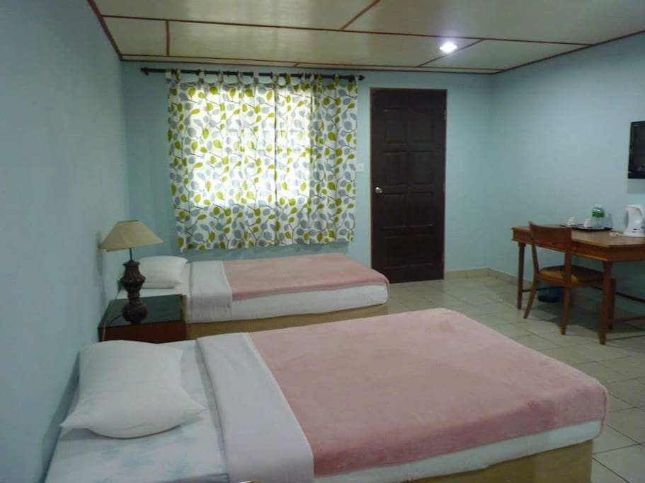 Twin room with 2 single bed and attached bathroom