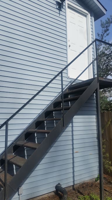 Stairs to your private studio living area in the carriage house.