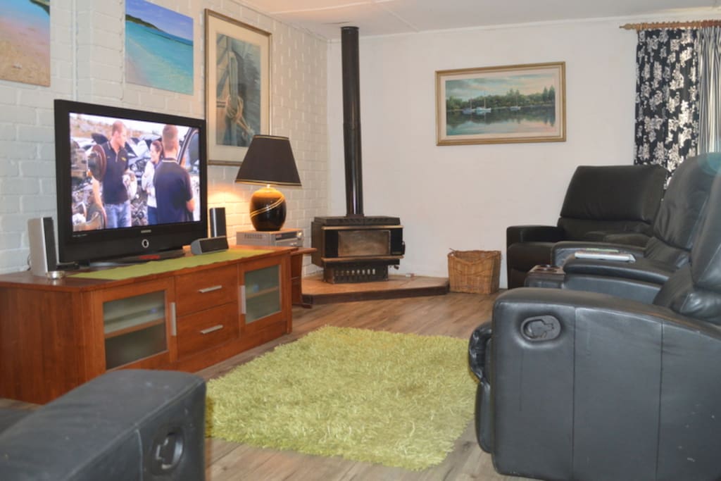 Warm and Cosy Lounge with 4 recliners and pot belly