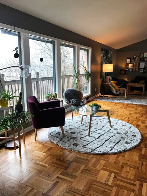 Spacious and stylish living space lined with large windows overlooking beautiful wooded ravine. Main level is one large connected space, including kitchen, dining room, seating area, living room with fireplace, game room, and bathroom.