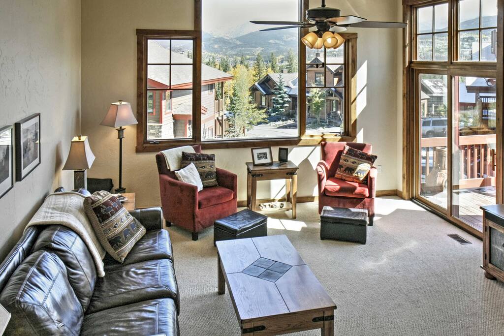 Spread out in the bright and inviting living room with lots of windows that allow natural light to fill the room.