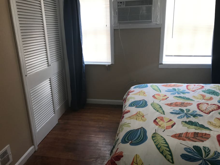 View across first bedroom, Large windows.