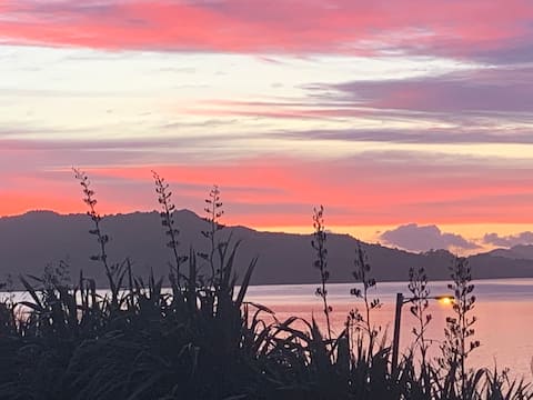 Watch the sunrise over the Whangarei Heads