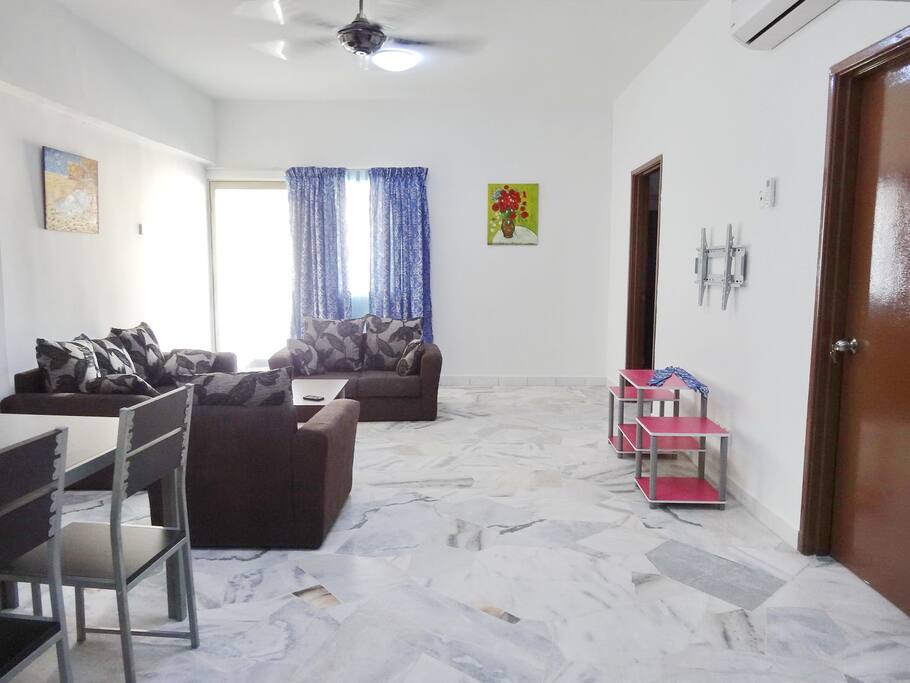 Air-conditioned living room with balcony.