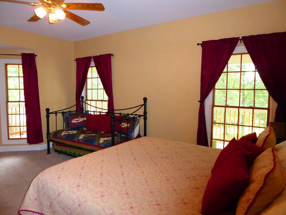 Master bedroom on main level. King bed, daybed and trundle.