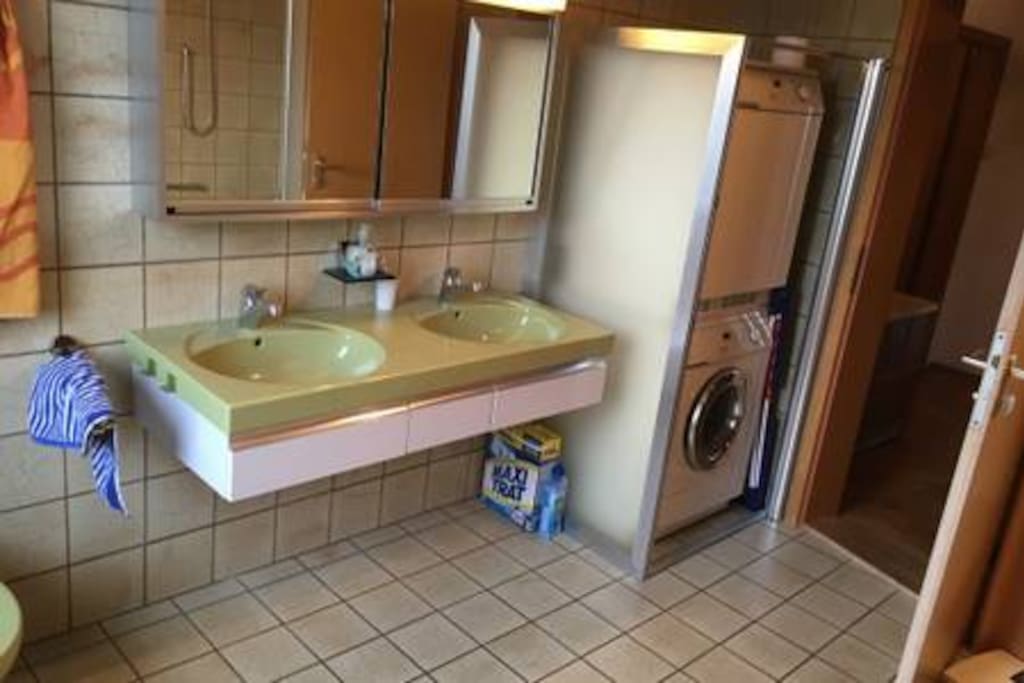 Bathroom with wash machine, drier and double sink
