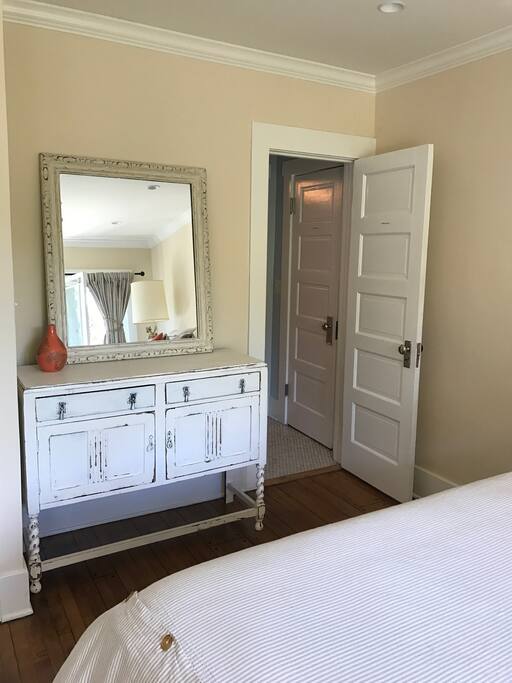 Antique Dresser and door to Private Bath