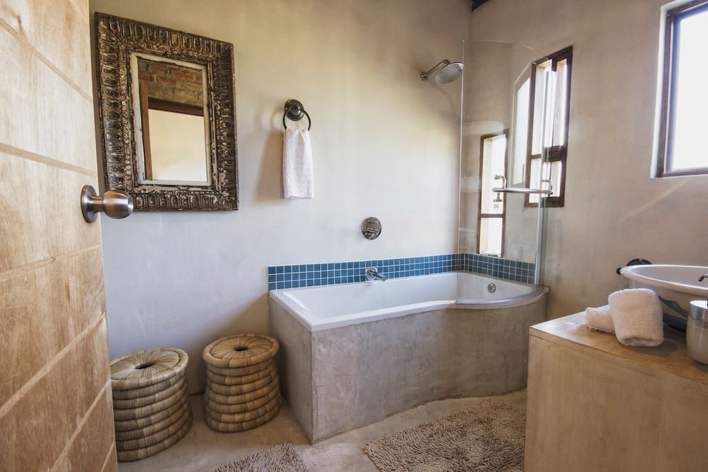 en-suite bathroom with bath/shower. baby bath available on request