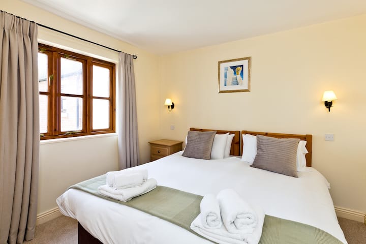 Bedroom two has views over the play area and natural lighting from the triple window makes this bedroom tranquil & relaxing,  the beds can be made up as a super-king bed or two singles. 