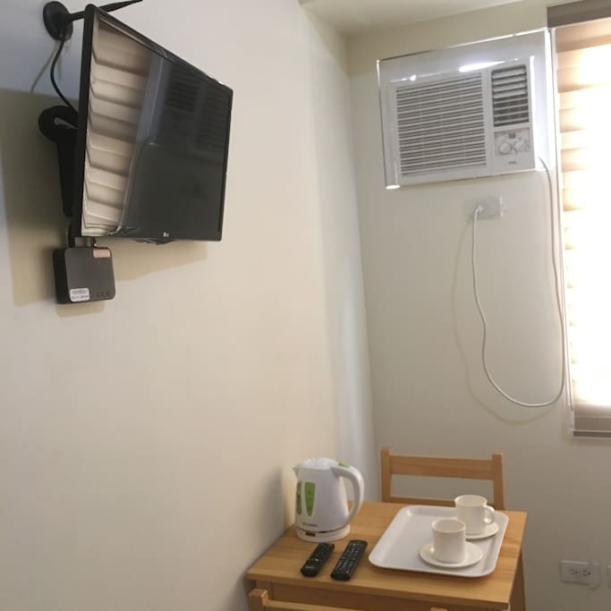 TV with digital local channels, Aircon, Kettle, Cups and working desk to use.