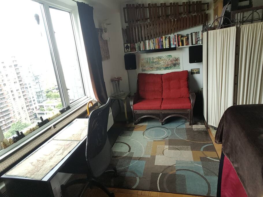 Settee and desk for desired in-room dining and relaxing