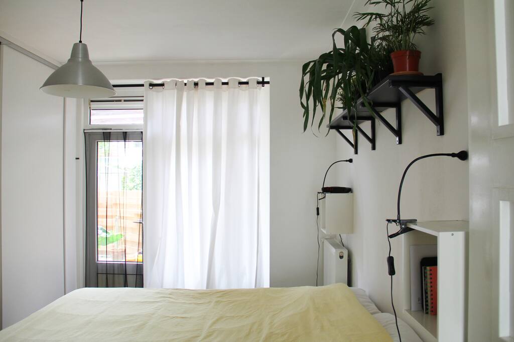 The bedroom with door to the backyard