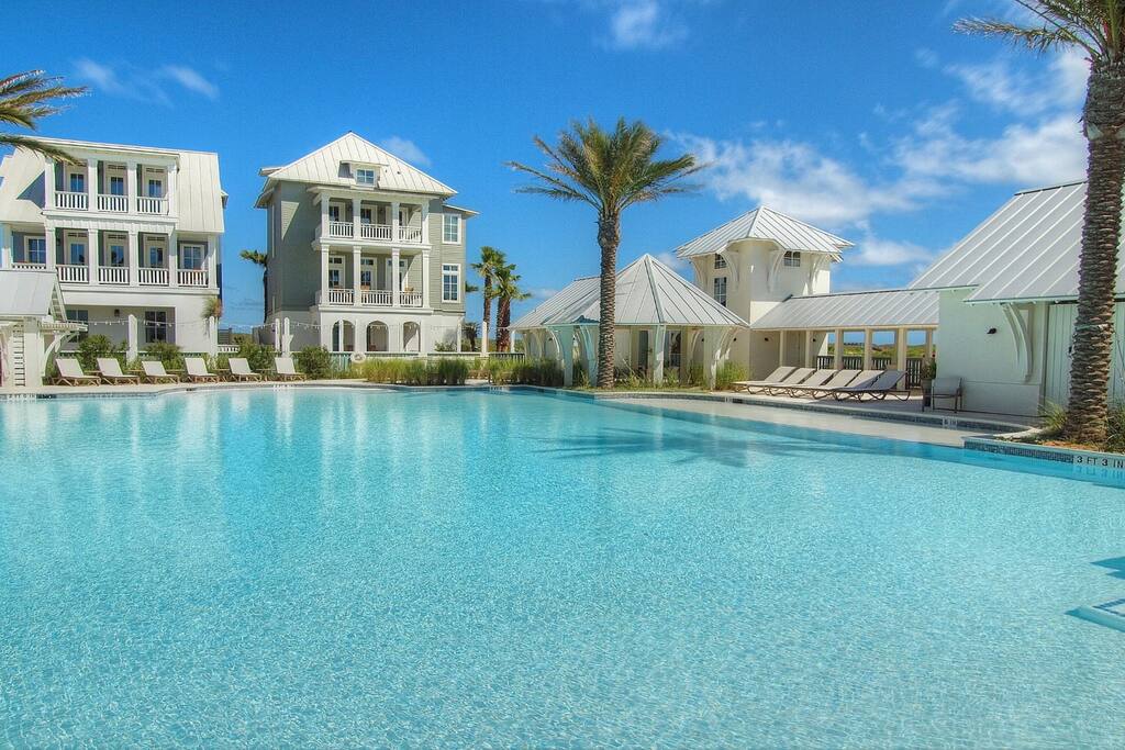 - 30 Yards from the Owners Townhouse
- Guest Services is here also (Bike rentals & more)
- Poolside Bar & Grill is opening soon
- Features a shallow shelf for sunning and/or small kids
- Free Poolside Movie Nights (Summer)
- No Lifeguard on duty
(Homes pictured are not of the Townhome, it is across the street in the opposite direction)