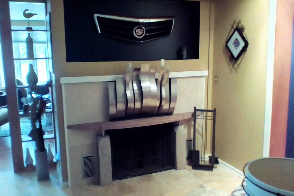 A wood-burning fireplace is the feature of this cozy nook.