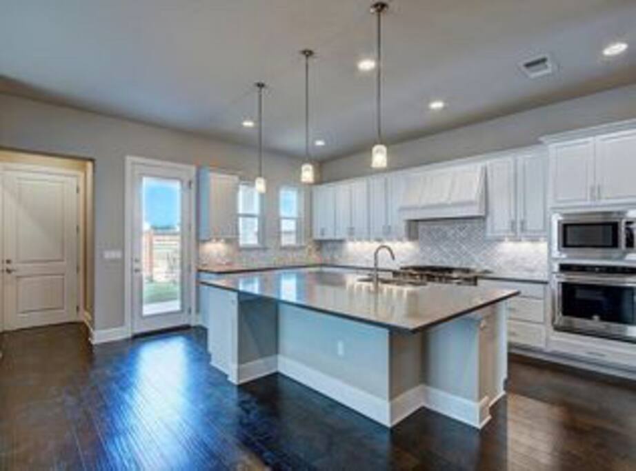 Huge Kitchen With Island Counter Top.