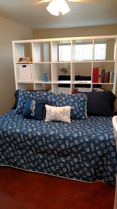 Daybed sofa converts to two full size twin beds.
