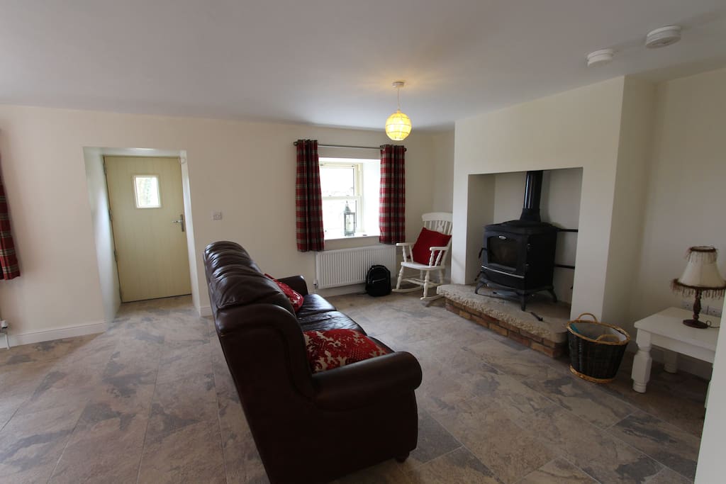 Living area with log burning stove, fuel provided