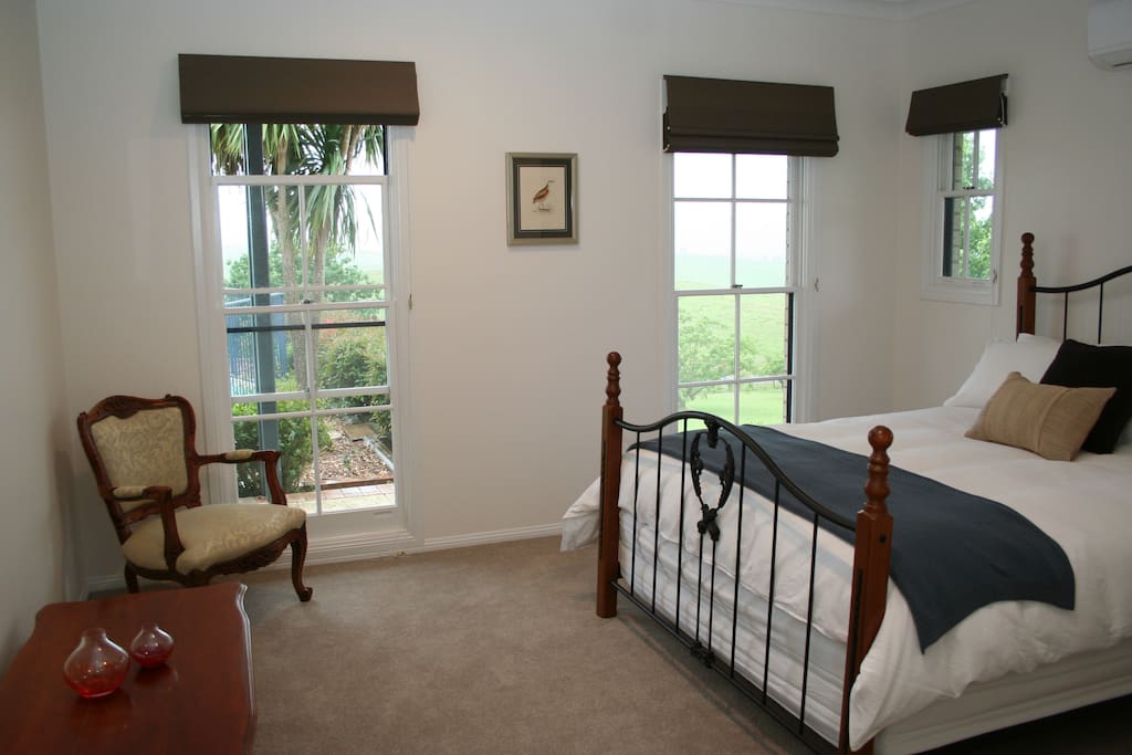 Bird song room - luxurious light filled room with queen bed, walk-in robe, bathroom, a/c