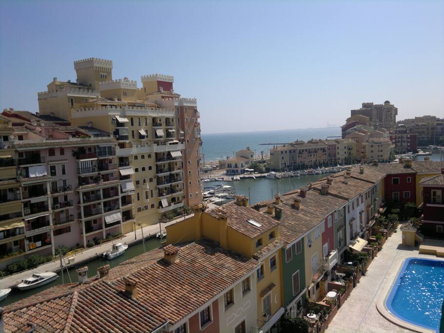 Aerial view of main pool, marina and sea.