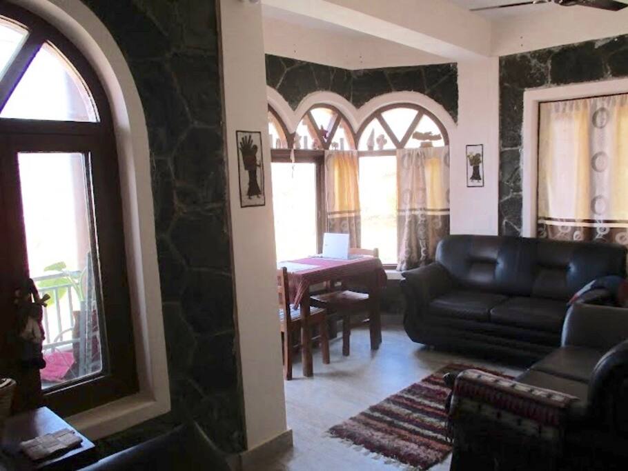 Living area with sofas and eating area.