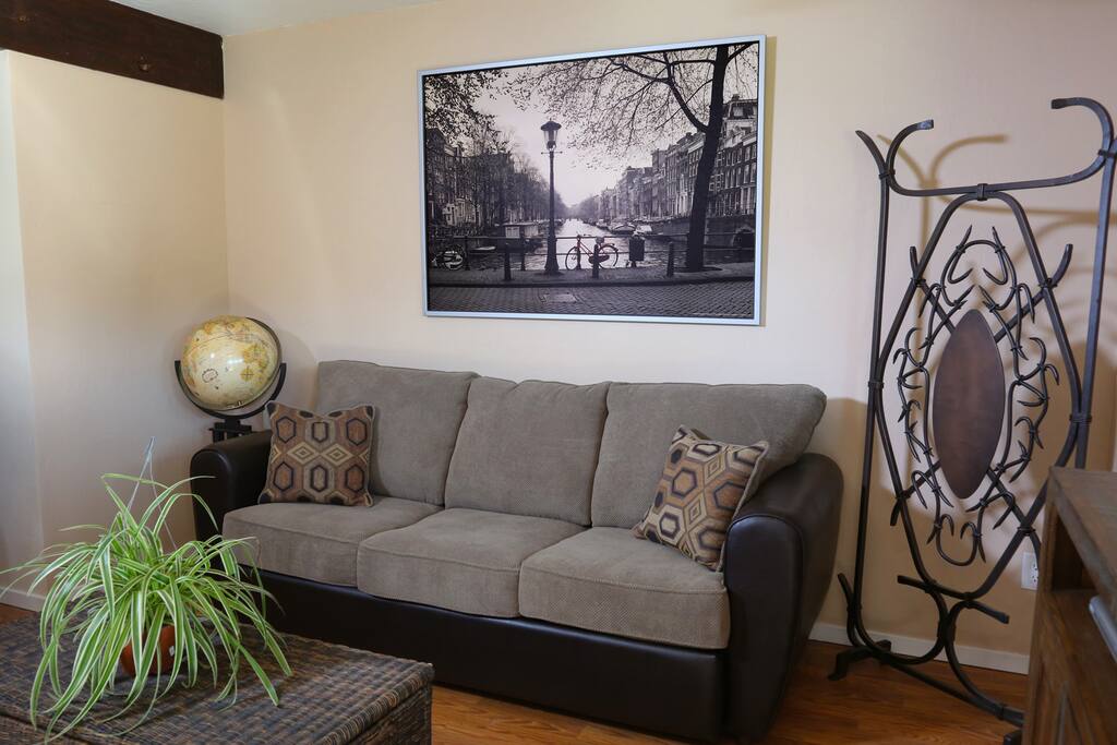 Very Cozy Living Room with a Queen Size Sleeper Sofa. No Worries about springs on your back sleeping here with the upgrades of a Memory Foam Mattress!