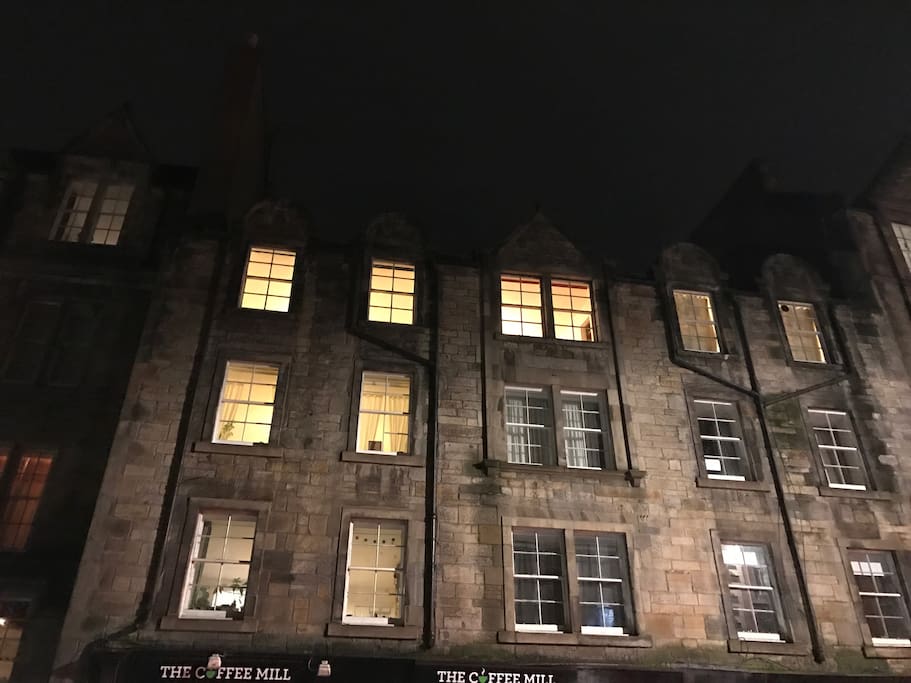 Outside view - top floor with the lights on is the apartment