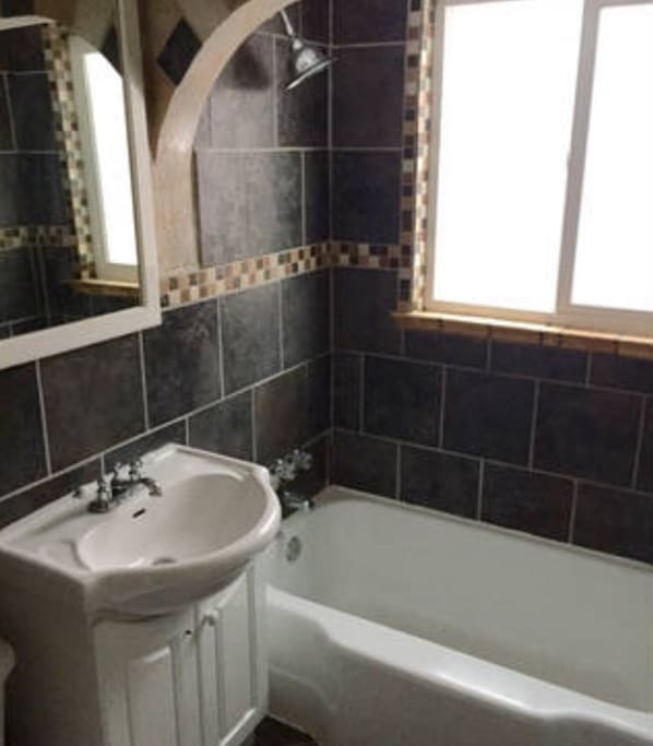 Nice bathroom with a tub for relaxing baths!