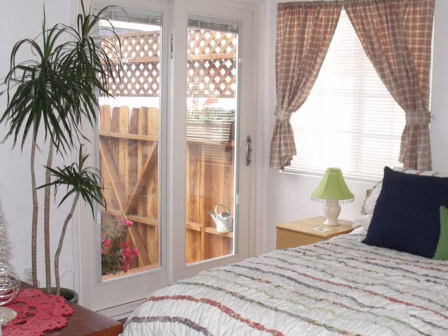 So light and airy, with your own private deck and access to the lush backyard.